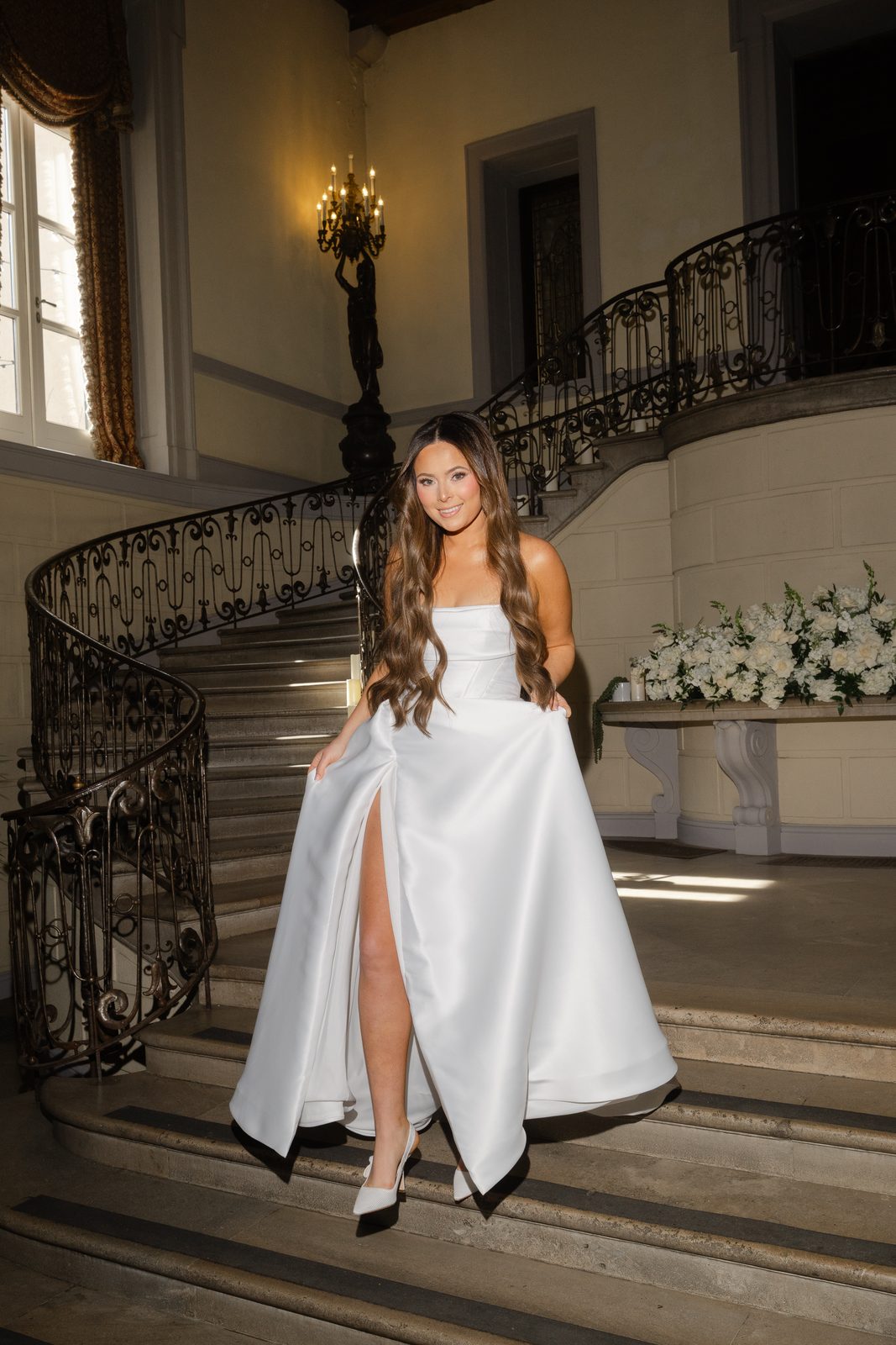 Rachel's KYHA gown on the staircase at Oheka Castle