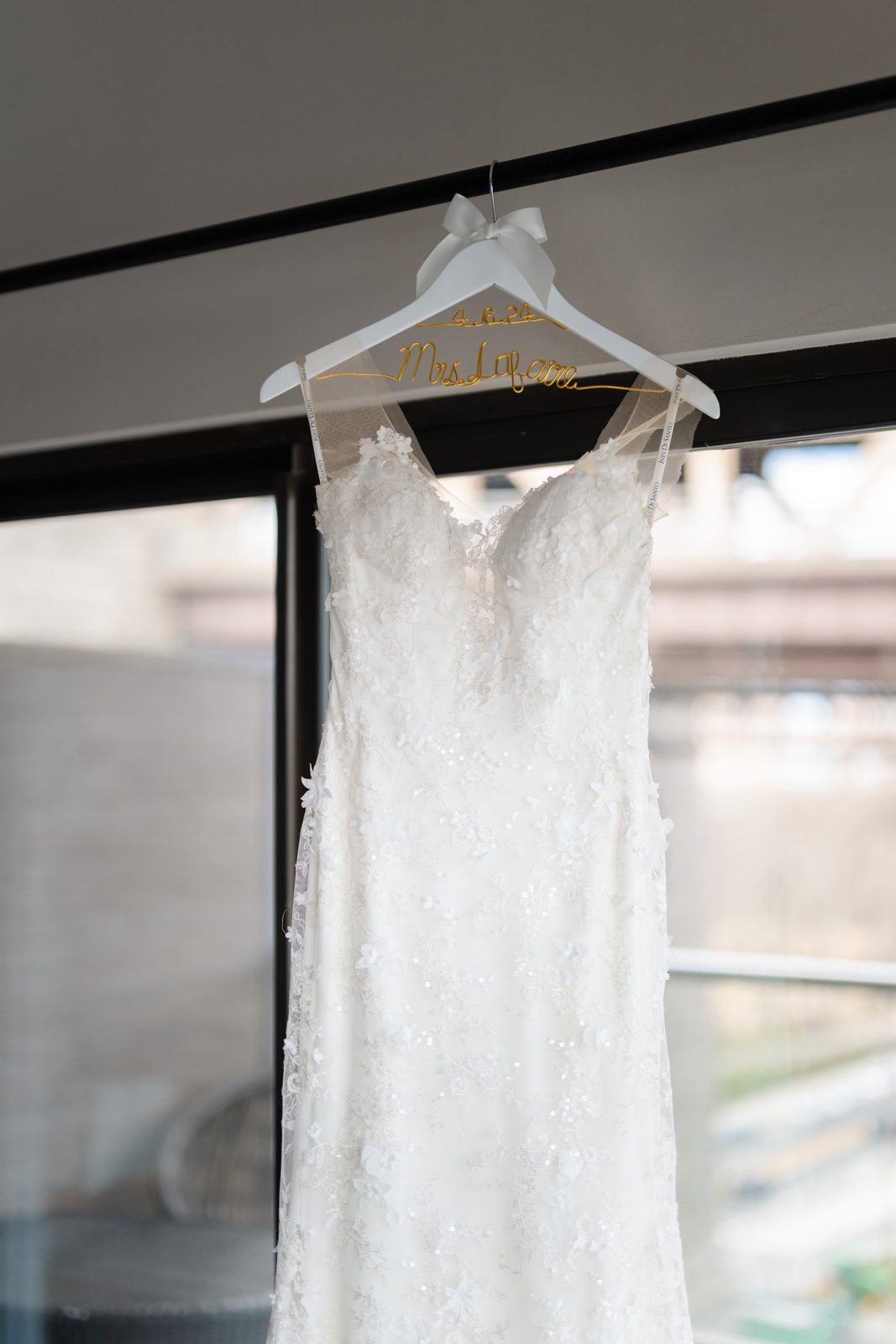 Amanda’s gown hanging in the window of the suite