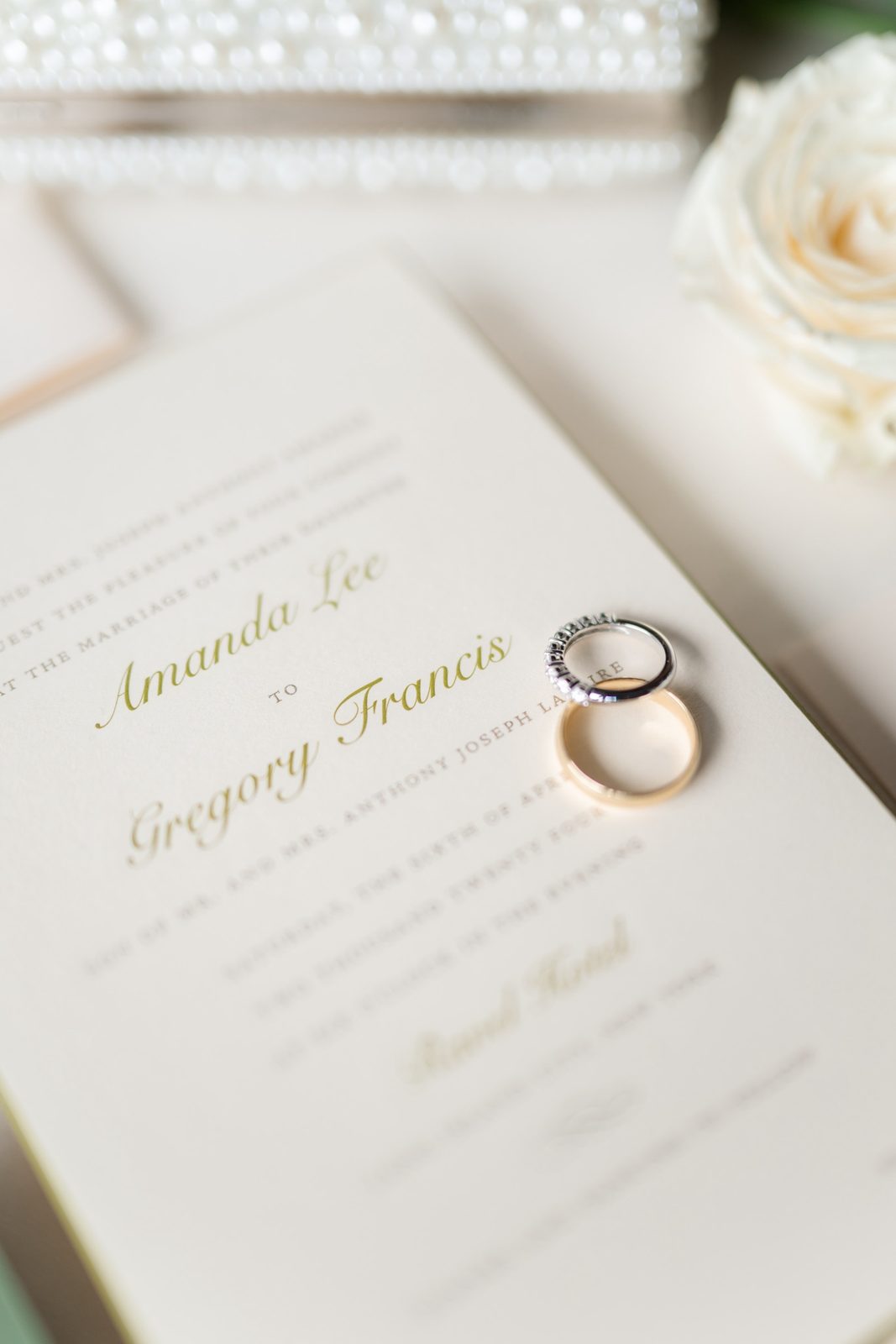 Amanda and Greg’s invitation with their rings