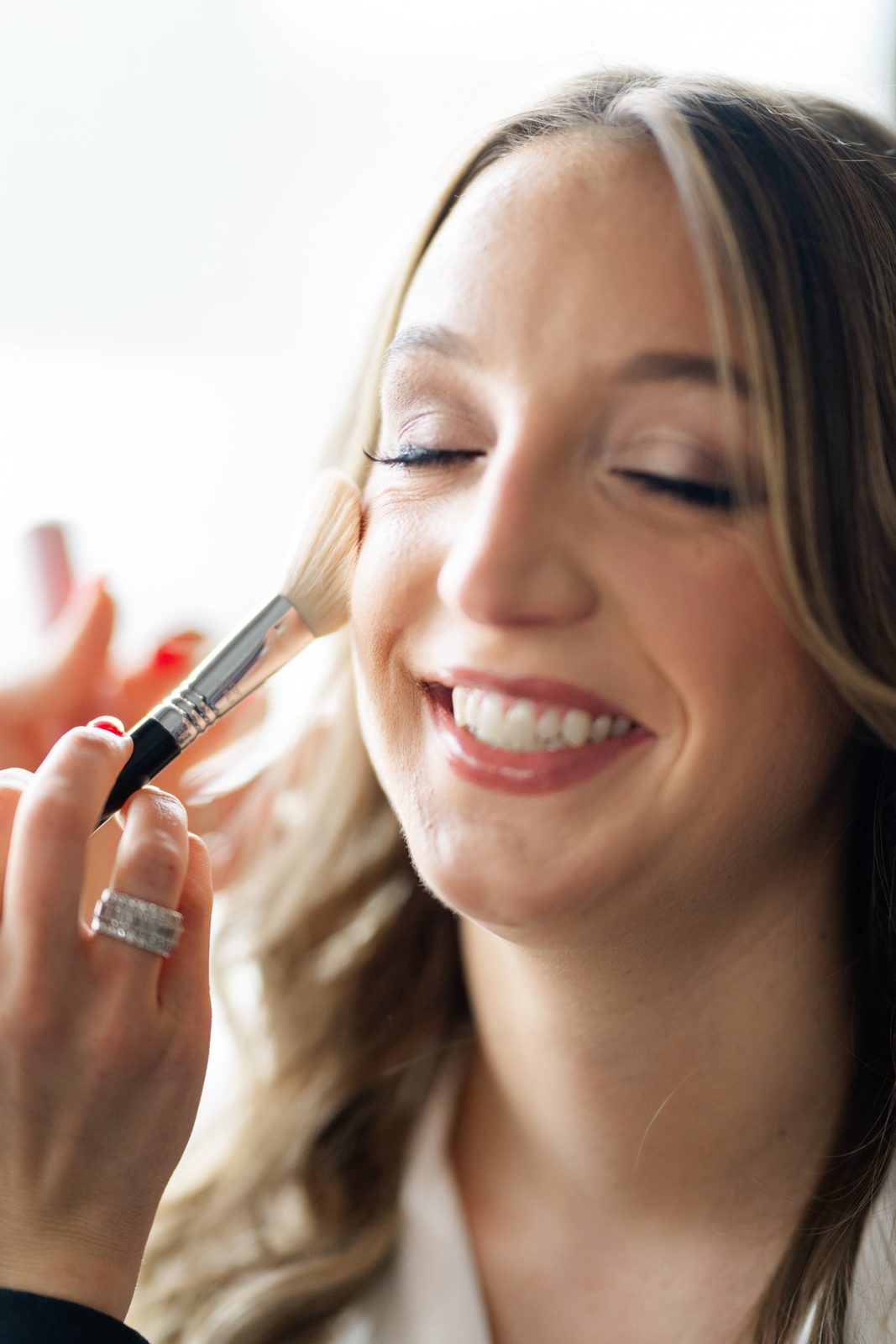 Amanda laughing during makeup