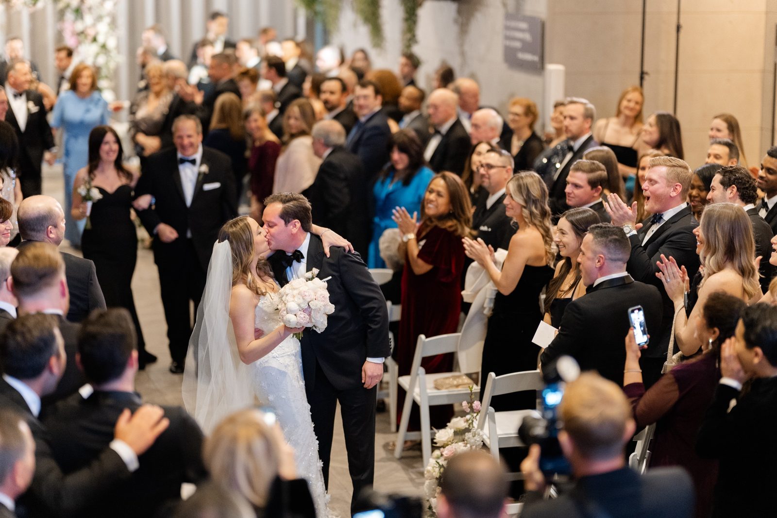 The recessional through their cheering guests