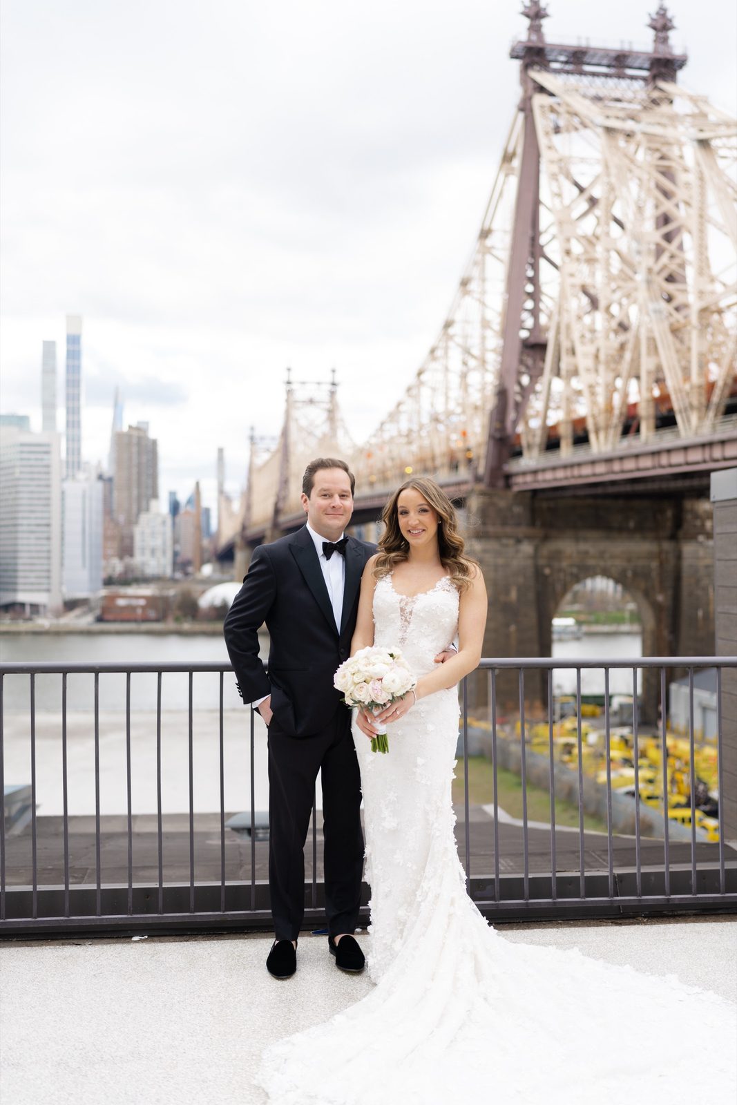 Amanda and Greg at the terrace railing by the bridge