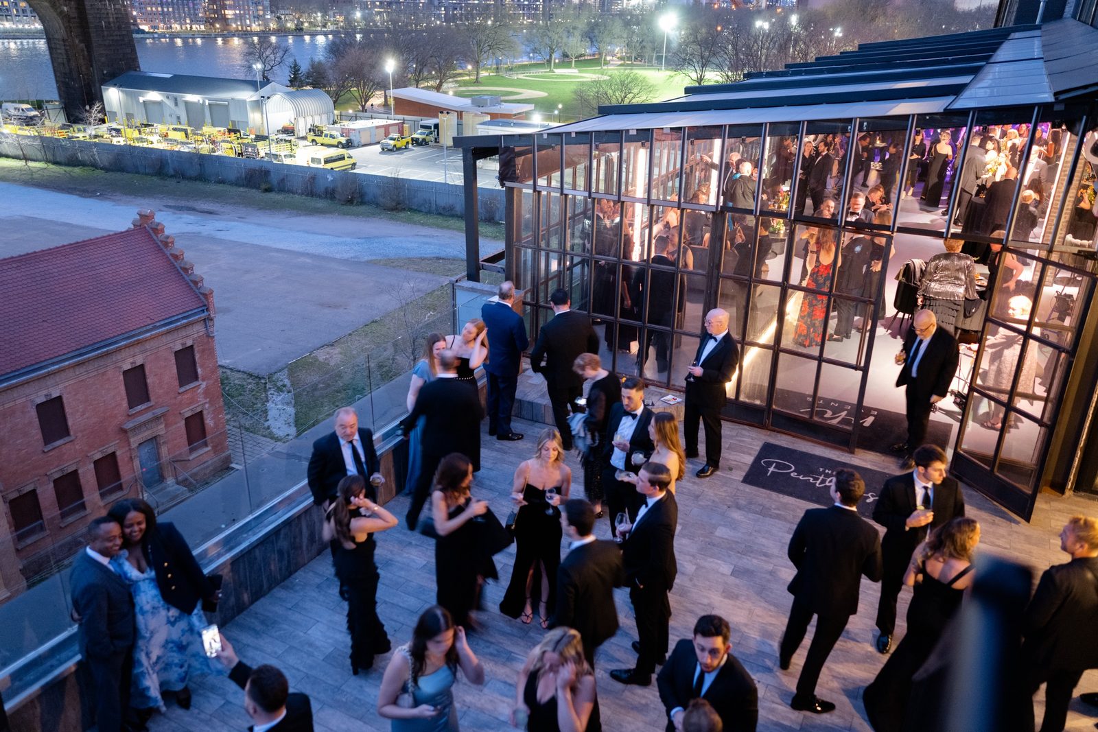 The terrace from above, full of guests at night