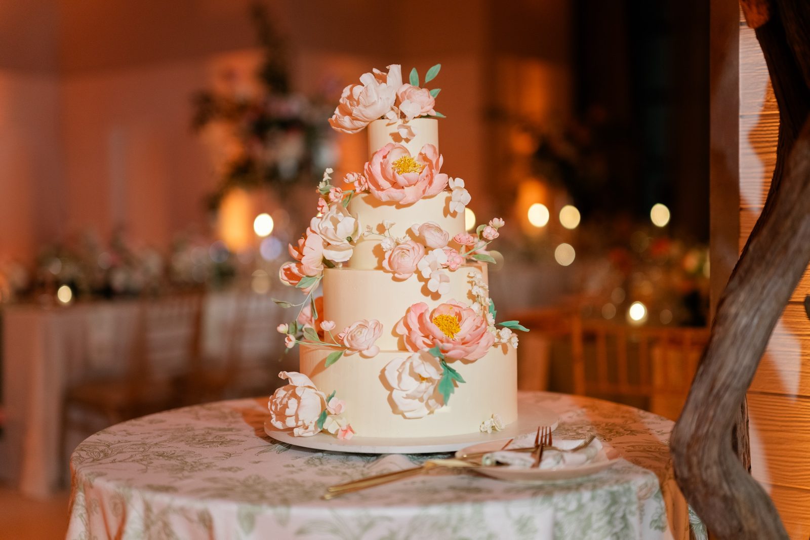 The wedding cake decorated with sugar flowers
