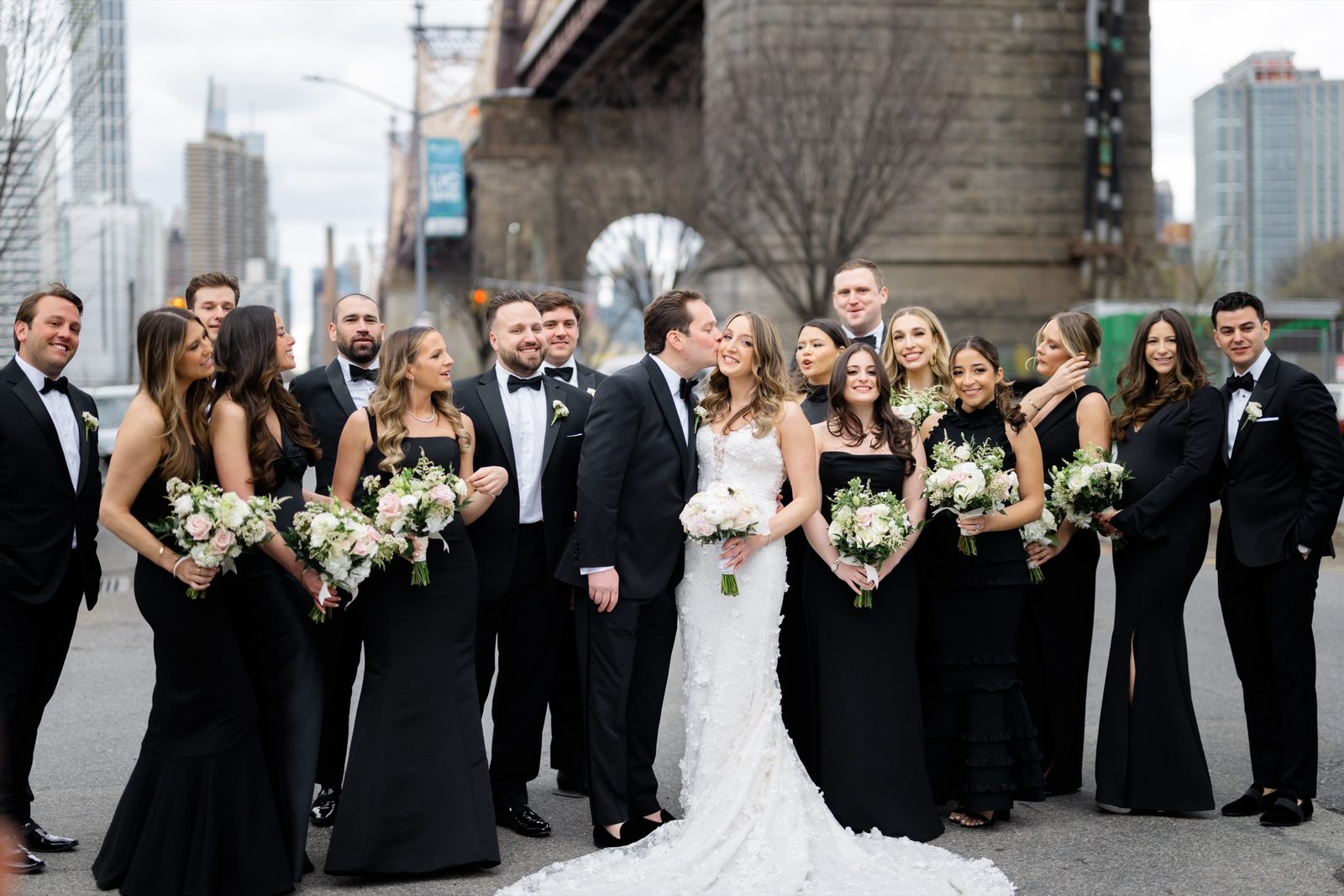 The wedding party on the street under the Queensboro Bridge