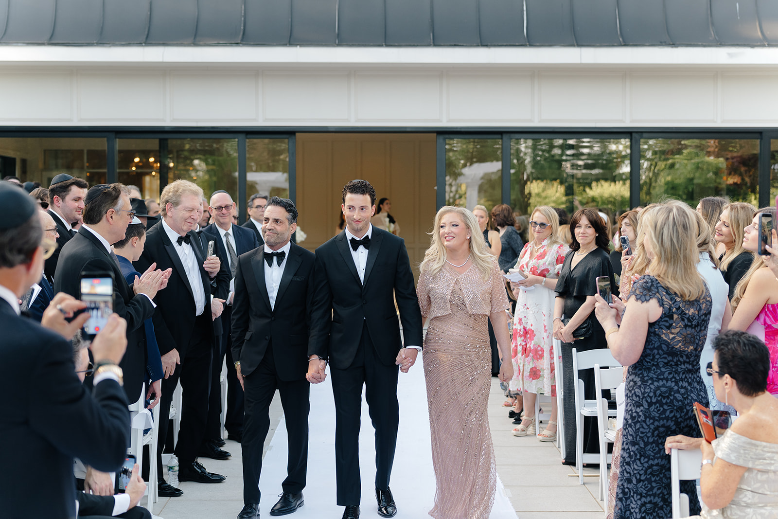 Rebecca and Phil’s outdoor wedding ceremony under a greenery-wrapped chuppah