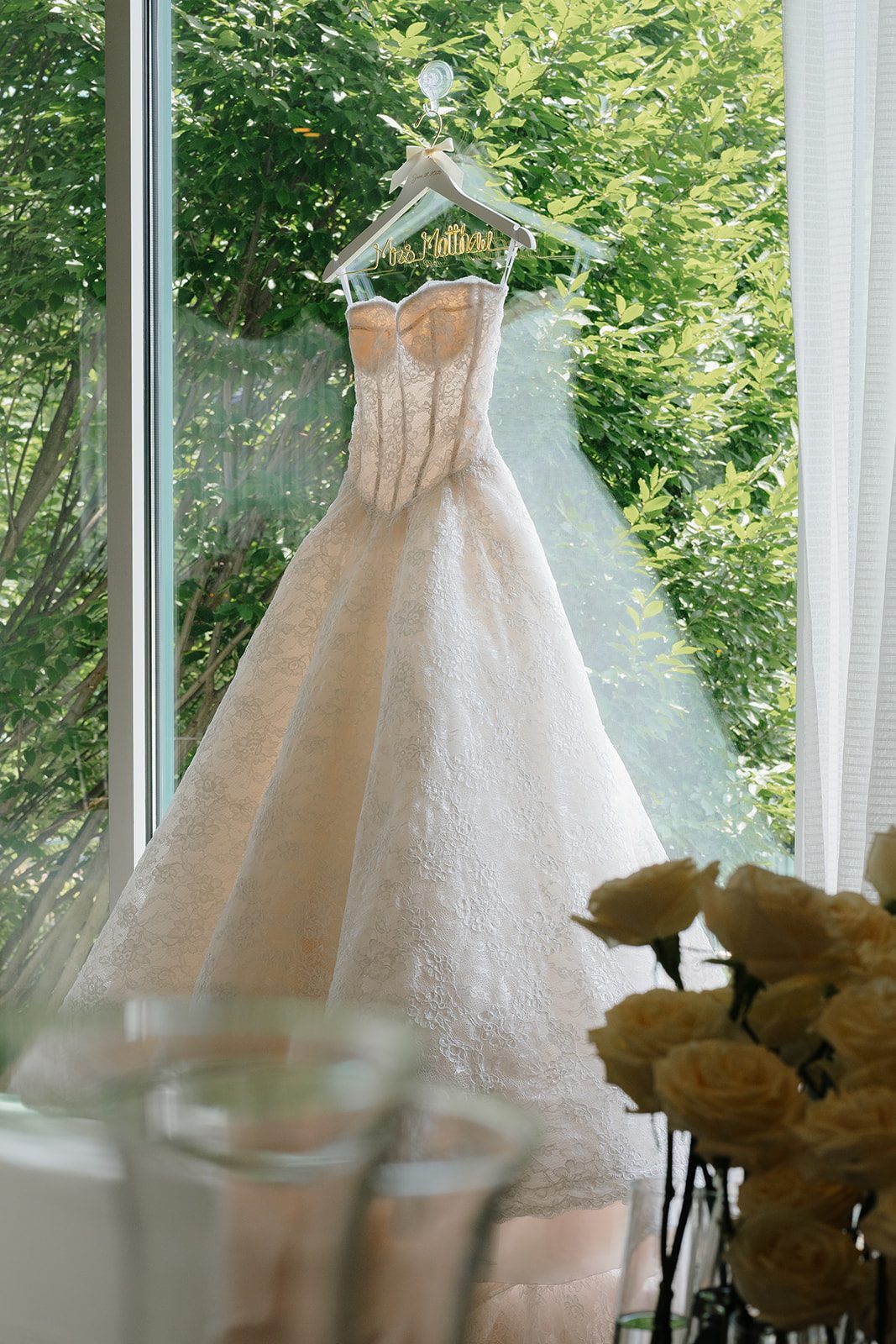 Anna Augusta wedding gown hanging in the window at Edgewood Country Club New Jersey