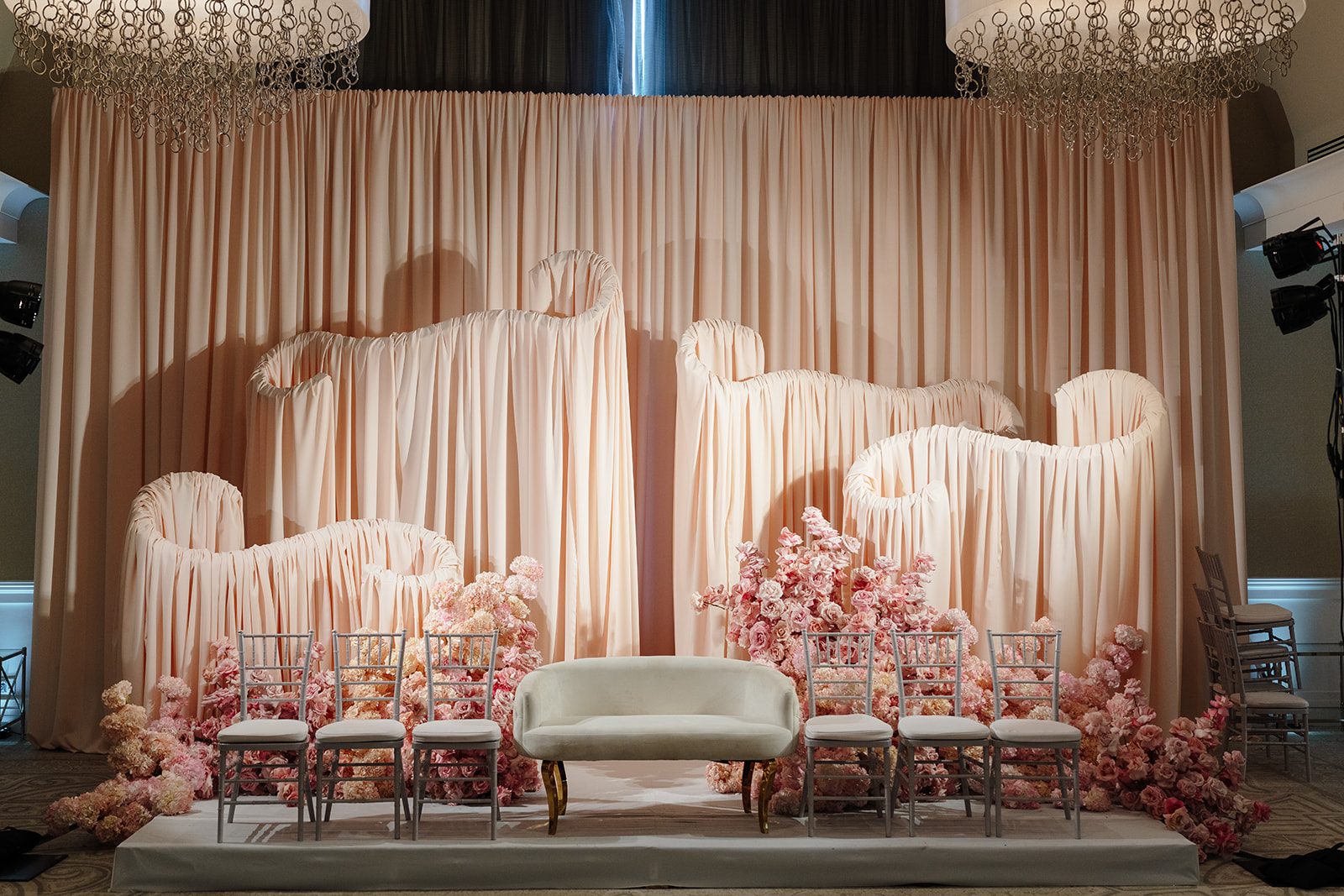 Blush draped lounge with pink florals by Papaya at Edgewood Country Club