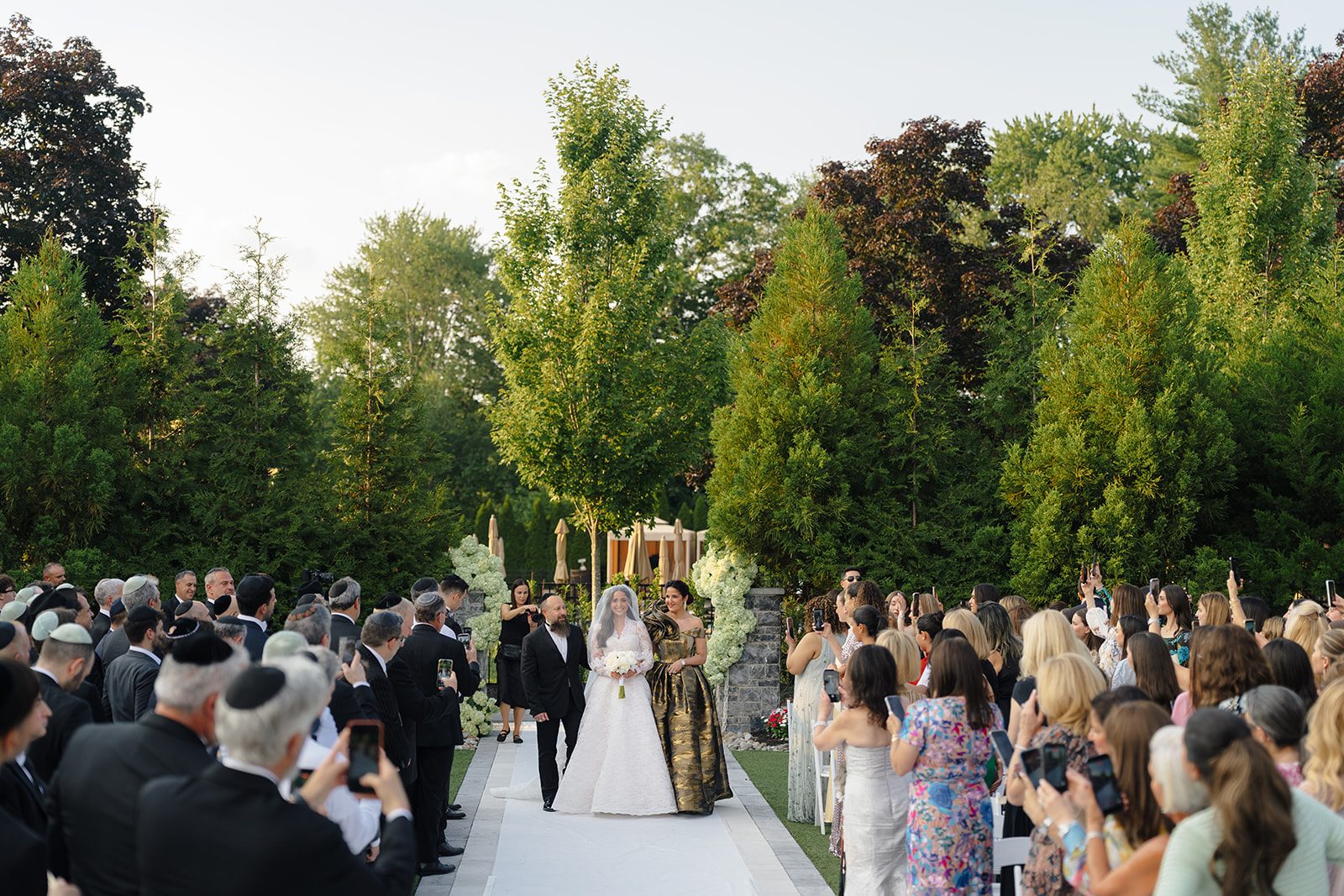 The bride processes down the garden aisle at Edgewood Country Club in River Vale NJ