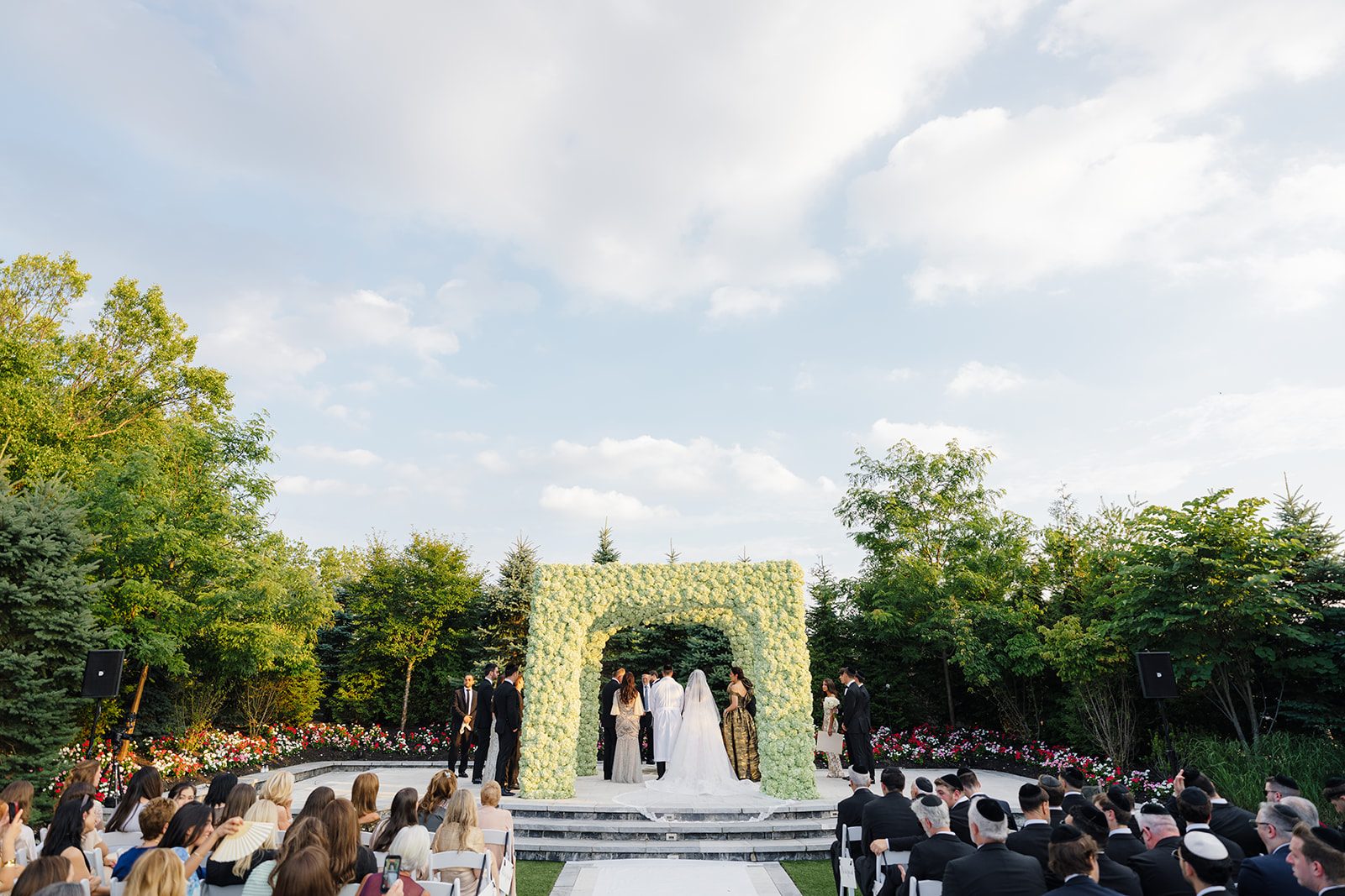 Wide view of the outdoor ceremony and greenery chuppah at Edgewood Country Club New Jersey