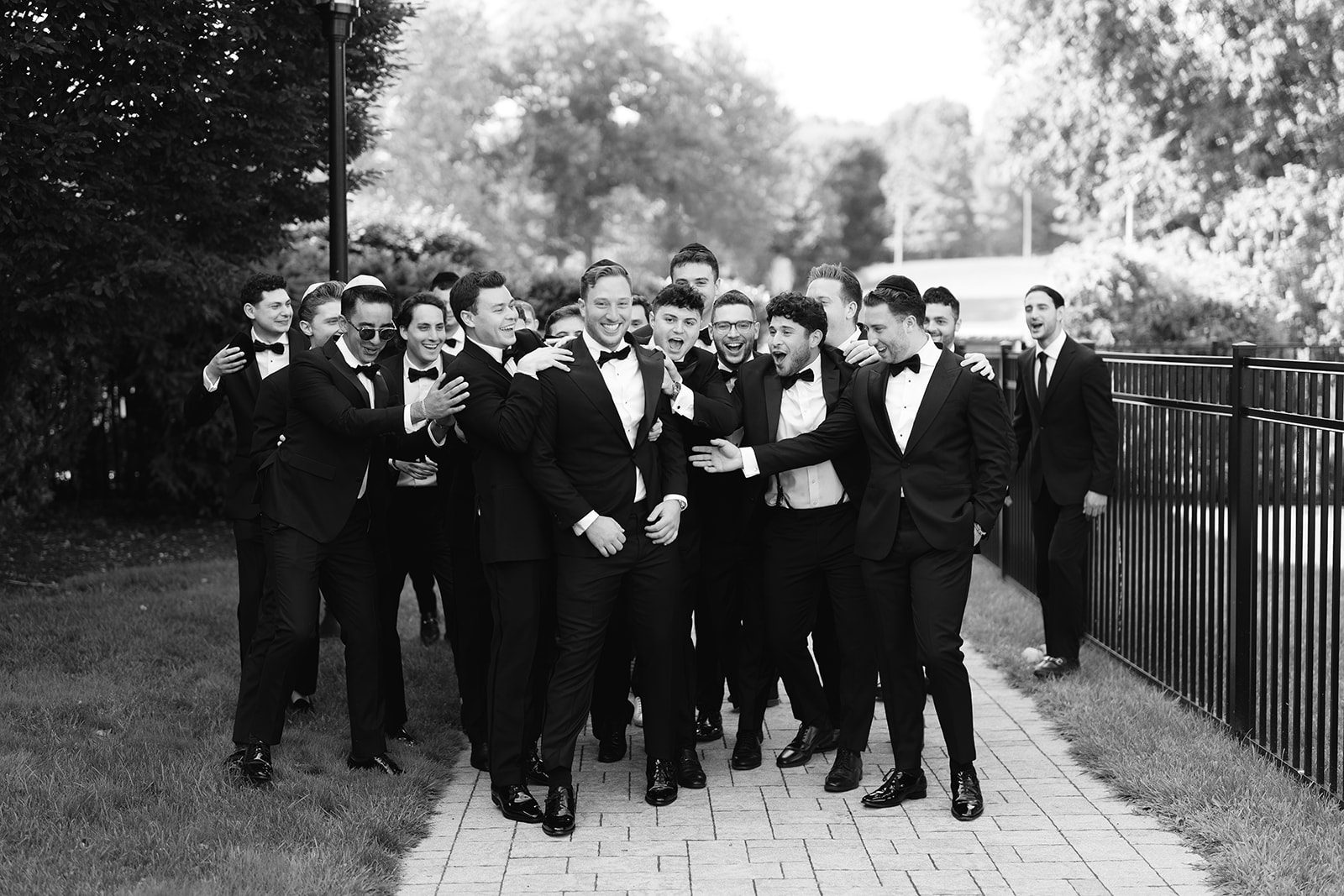 Groomsmen candid in black and white at Edgewood Country Club