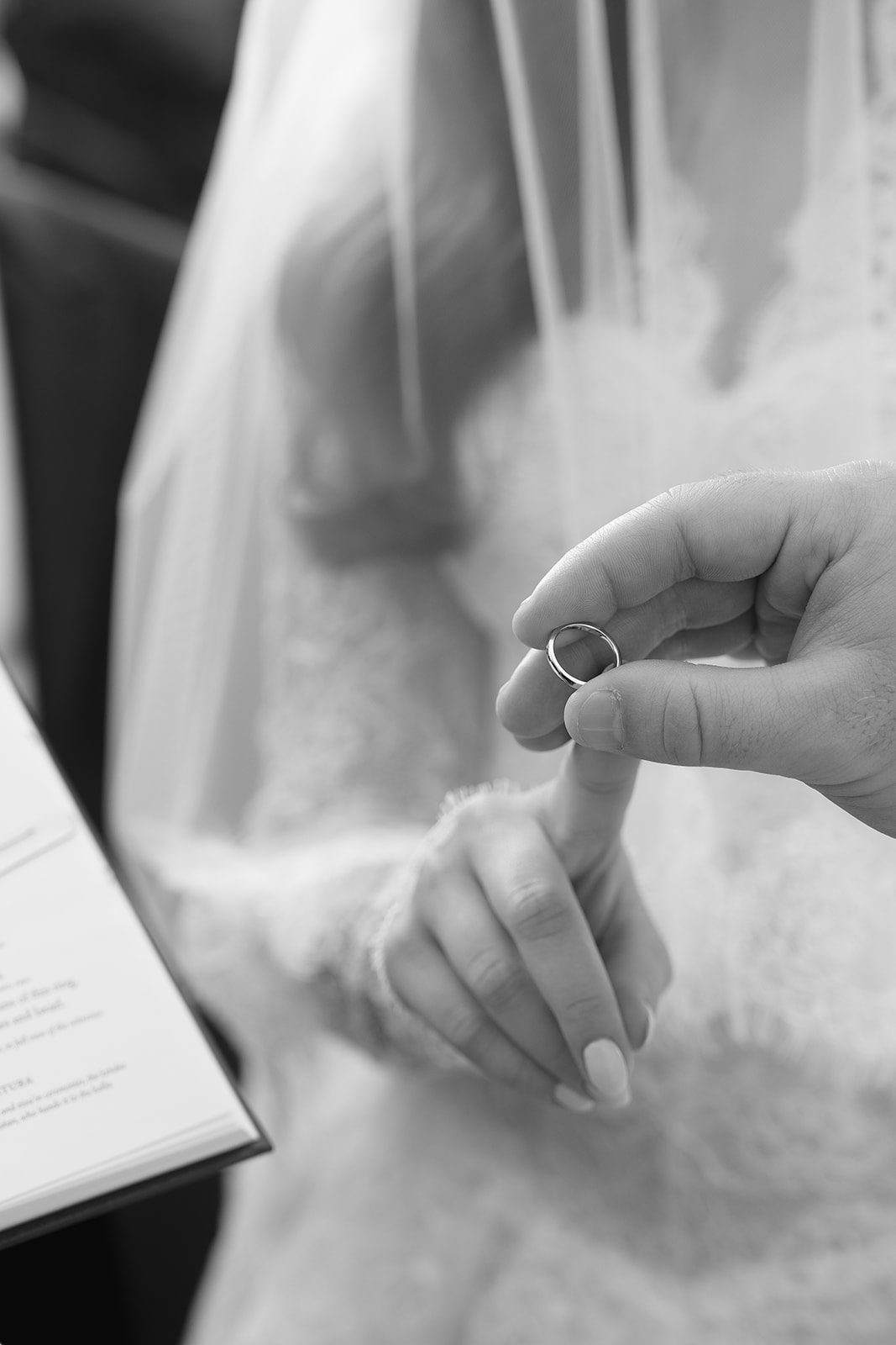 The wedding ring moments before it is placed on the bride&rsquo;s finger