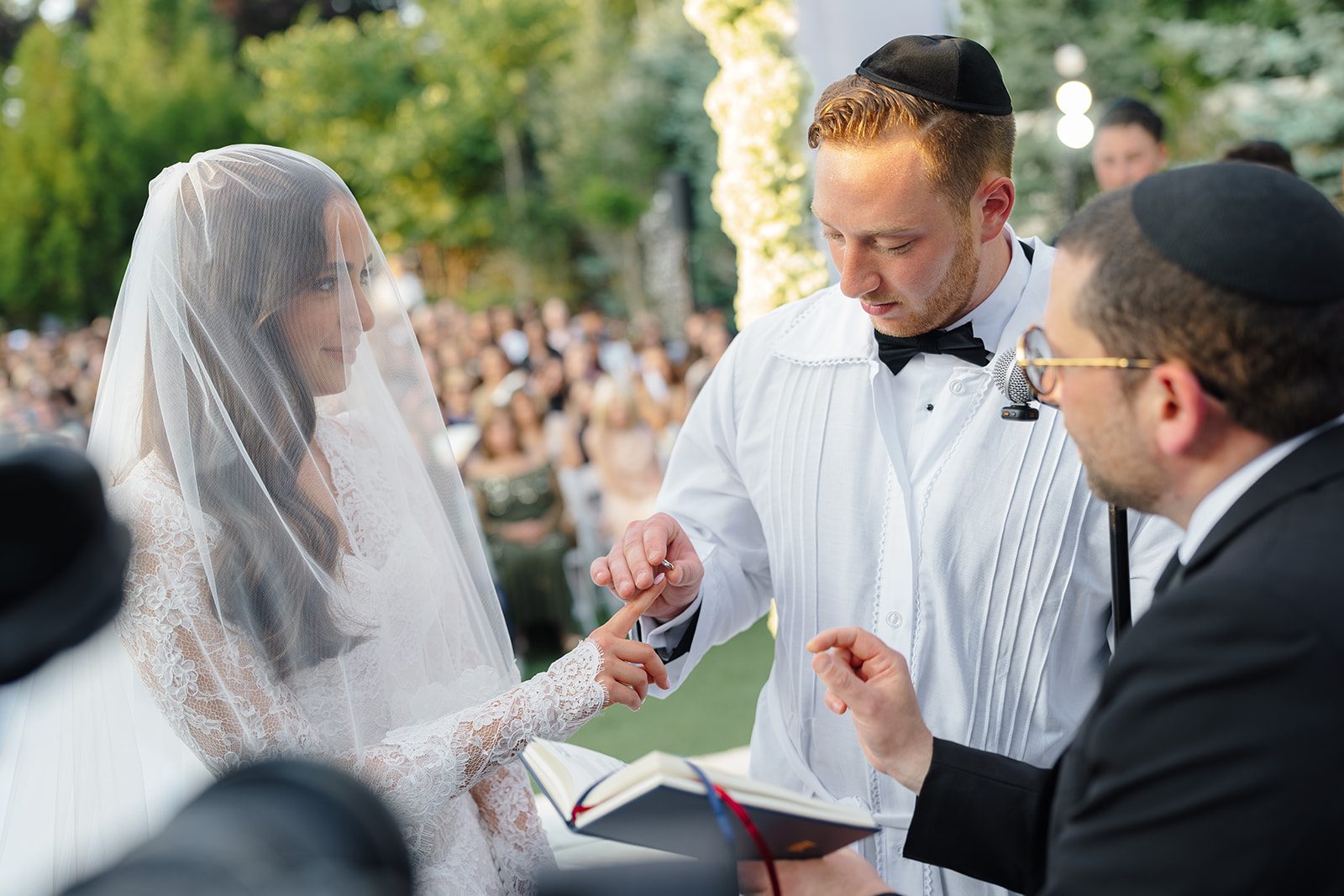 The ring exchange beneath the chuppah at Edgewood Country Club