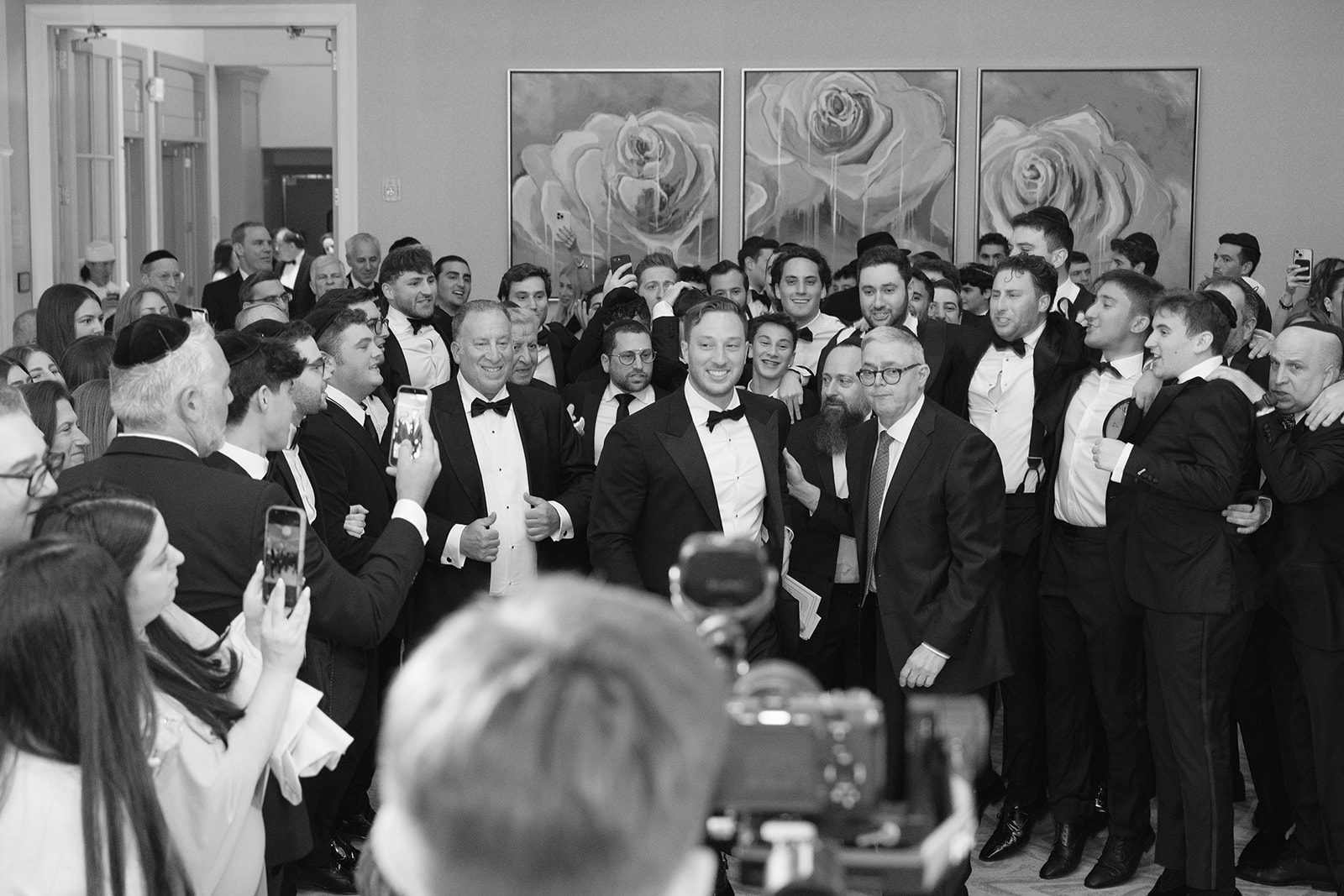 Black and white crowd of guests at the tisch