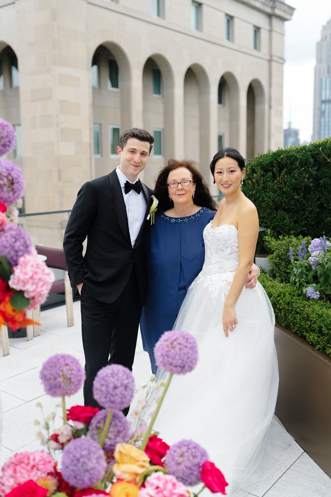 Family portraits at a Le Jardin sur Madison rooftop wedding