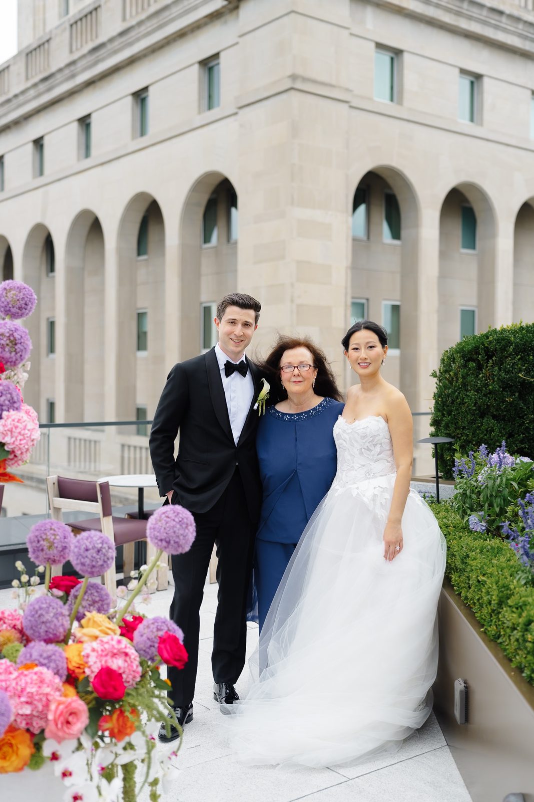 Family portraits at a Le Jardin sur Madison rooftop wedding
