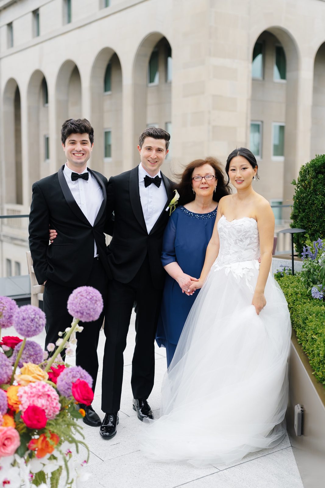 Family portraits at a Le Jardin sur Madison rooftop wedding