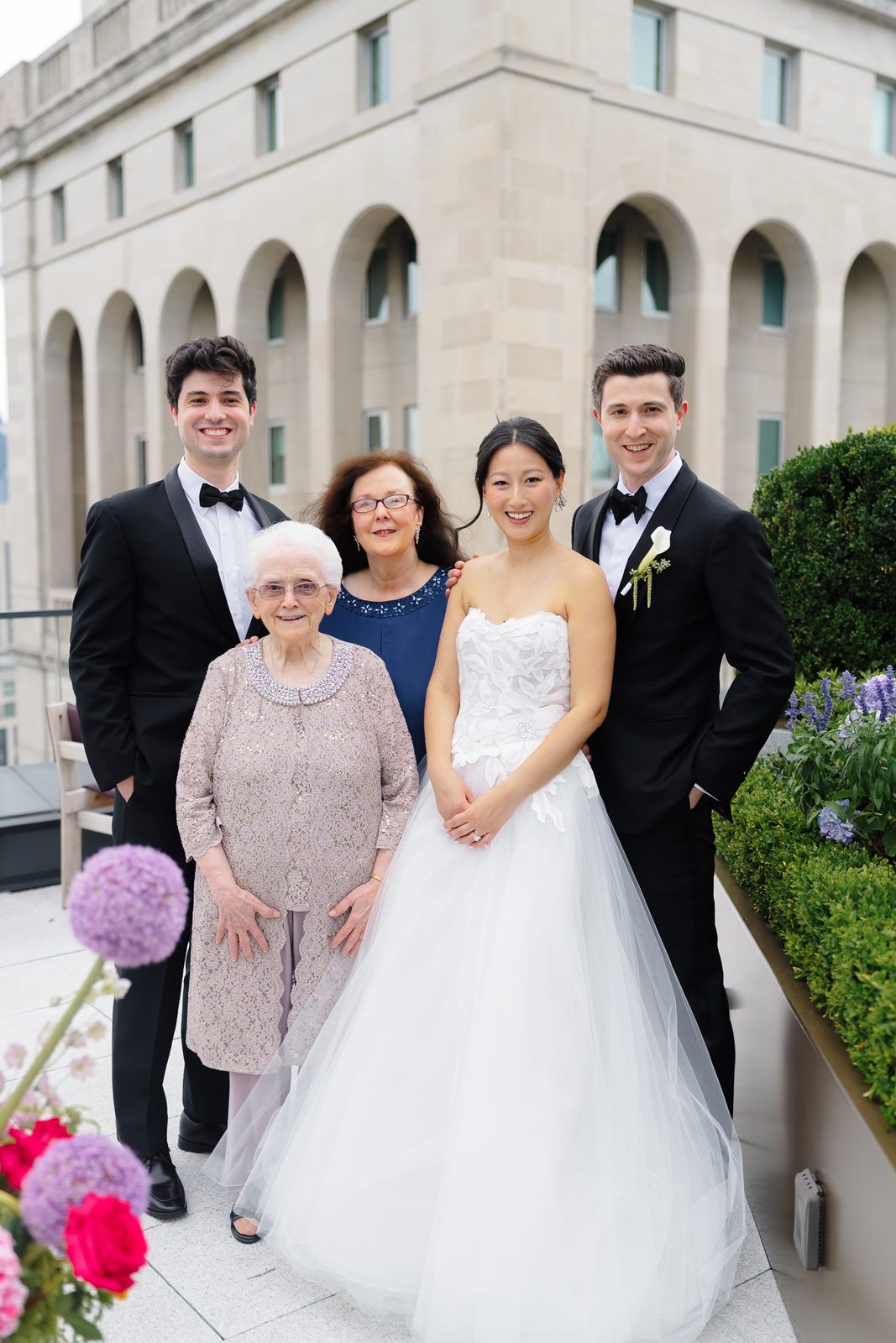 Family portraits at a Le Jardin sur Madison rooftop wedding