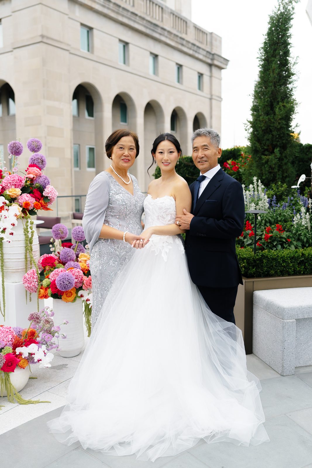 Family portraits at a Le Jardin sur Madison rooftop wedding