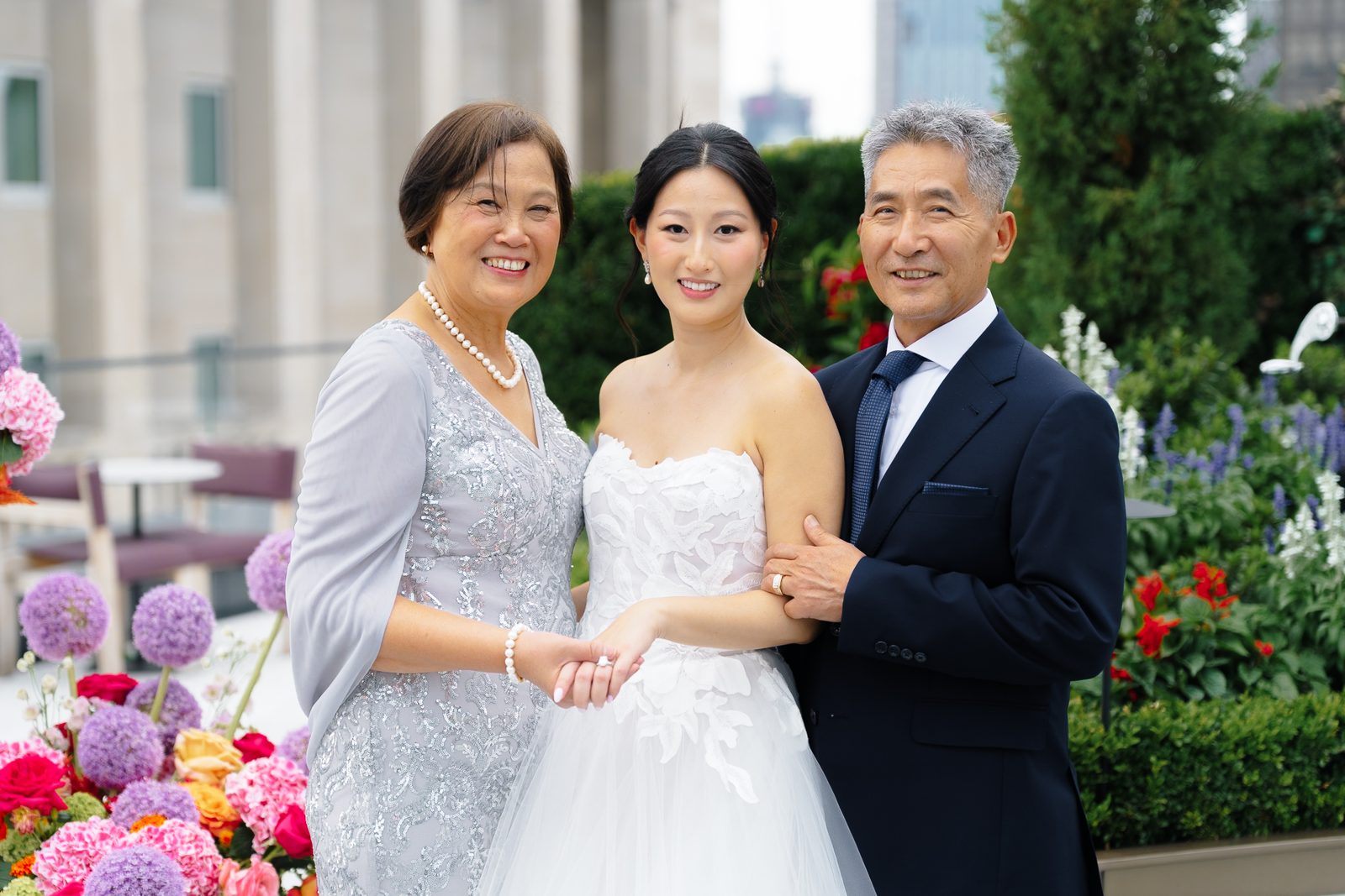 Family portraits at a Le Jardin sur Madison rooftop wedding