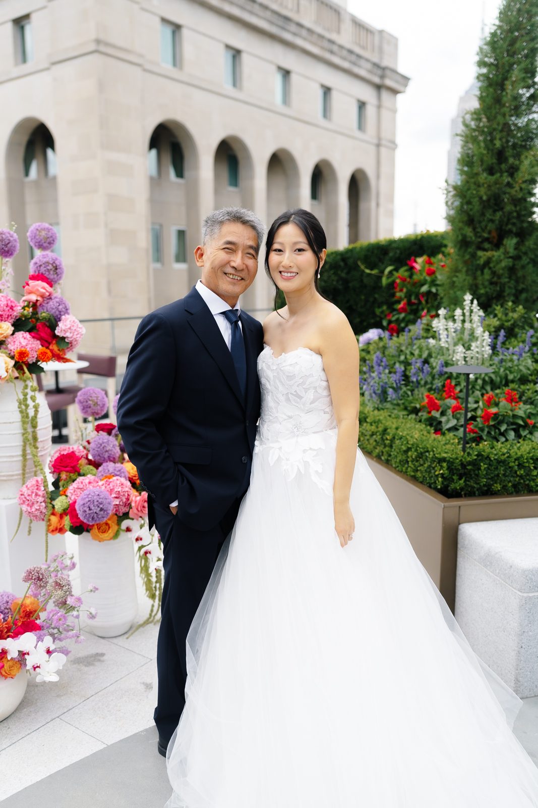 Family portraits at a Le Jardin sur Madison rooftop wedding