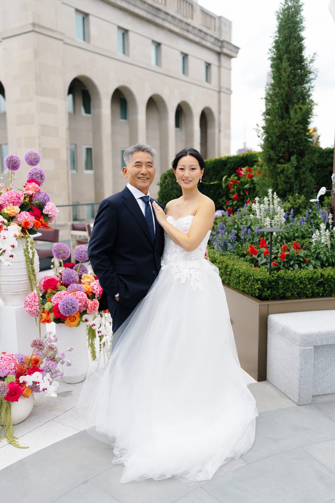 Family portraits at a Le Jardin sur Madison rooftop wedding