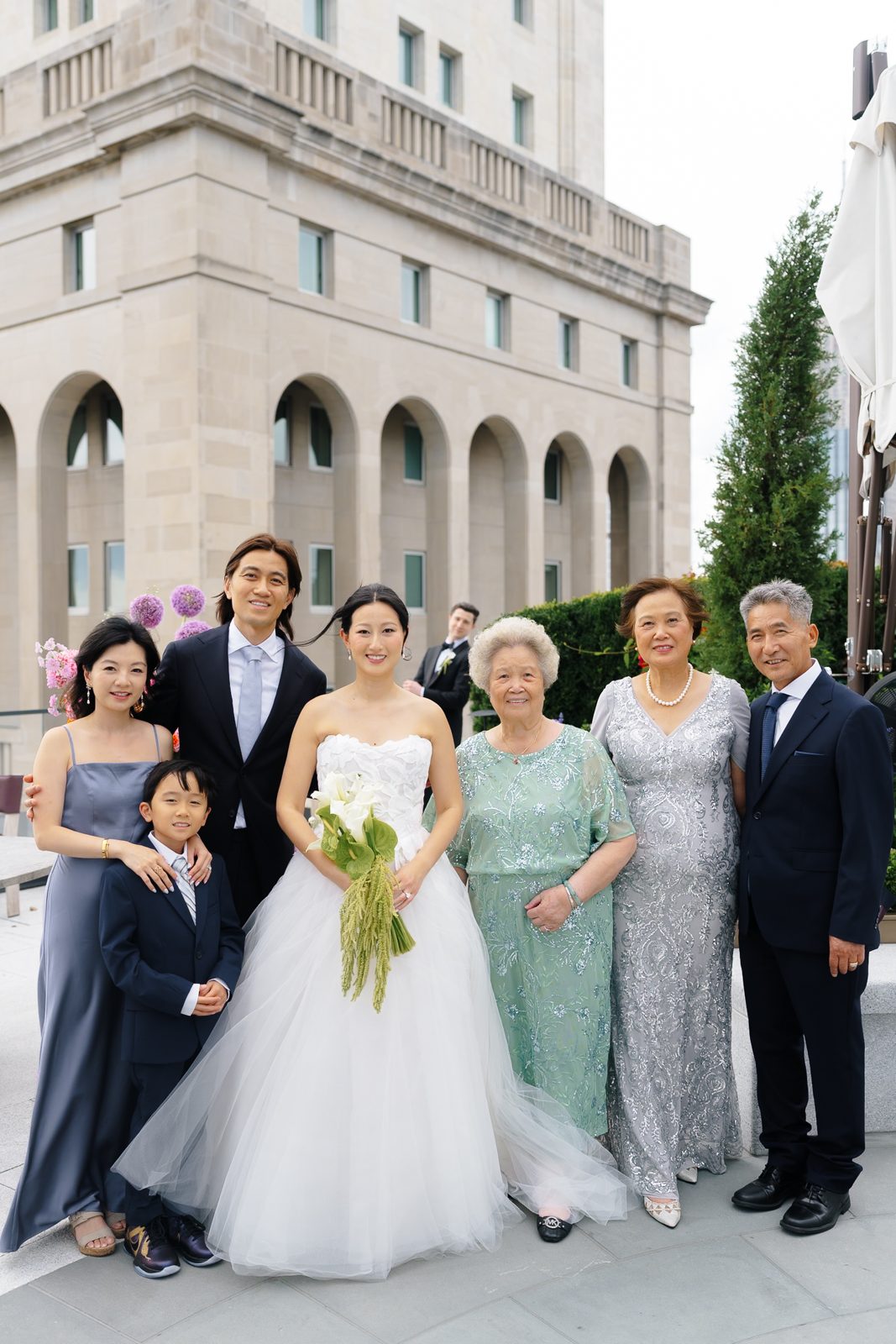 Family portraits at a Le Jardin sur Madison rooftop wedding