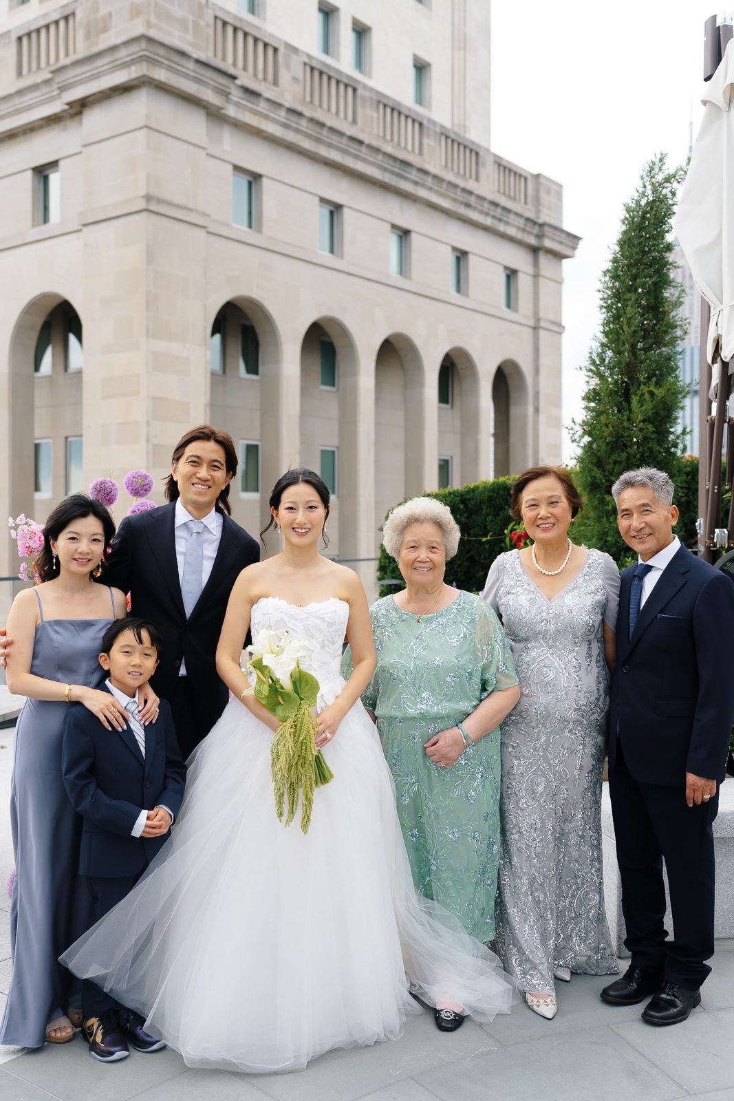 Family portraits at a Le Jardin sur Madison rooftop wedding