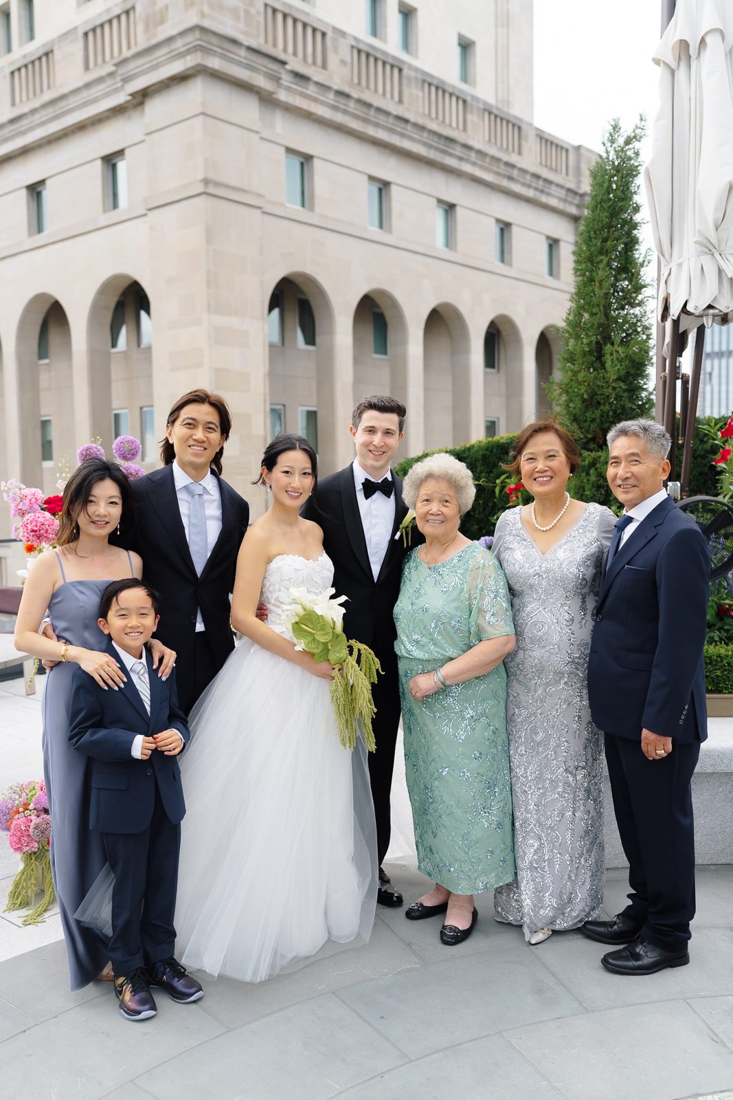 Family portraits at a Le Jardin sur Madison rooftop wedding