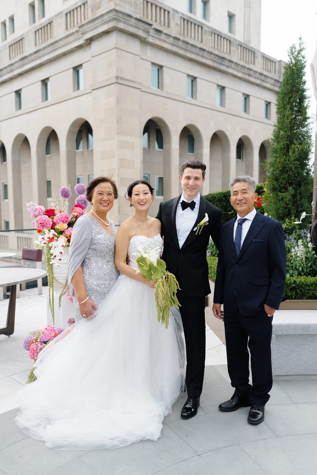 Family portraits at a Le Jardin sur Madison rooftop wedding