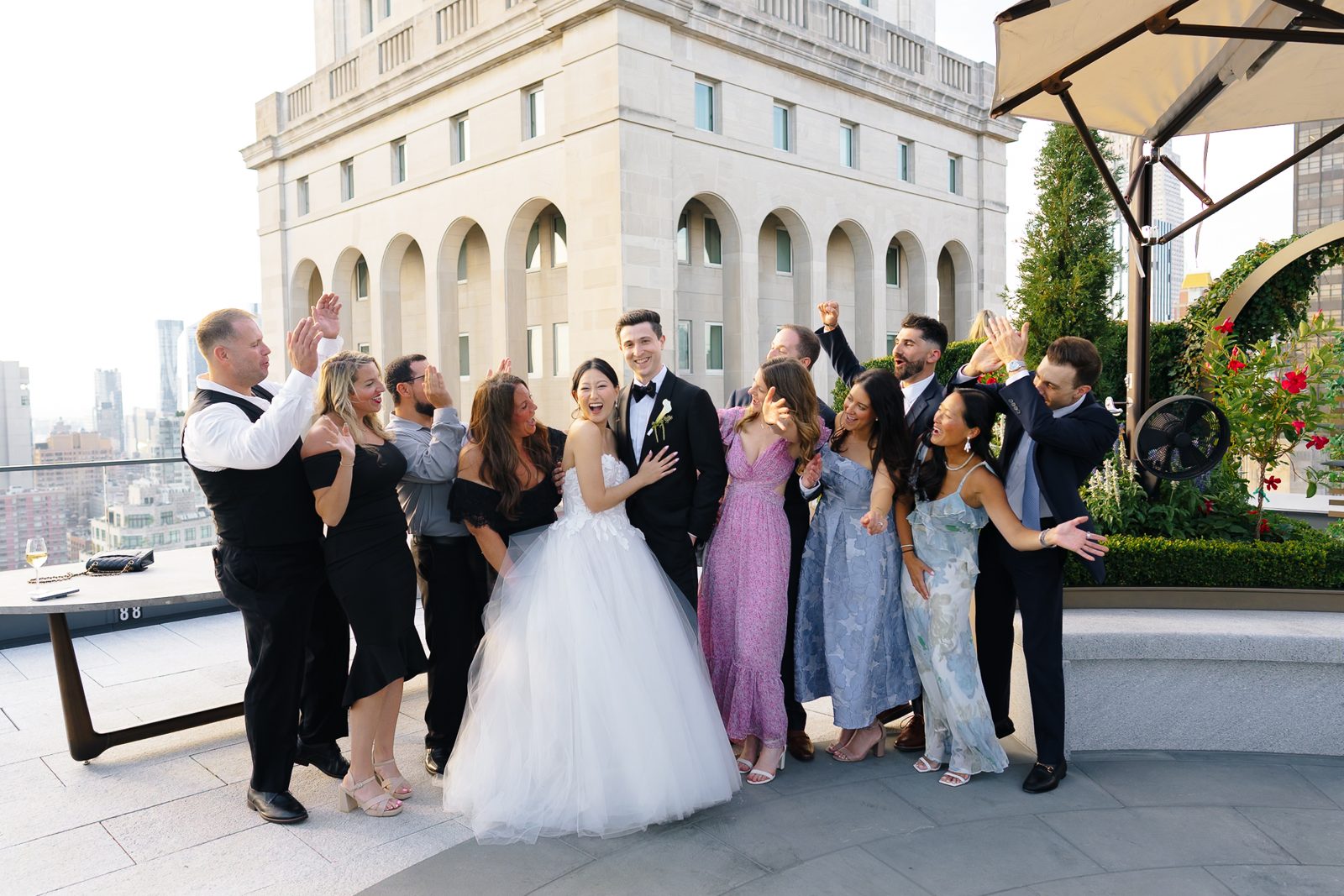Family portraits at a Le Jardin sur Madison rooftop wedding