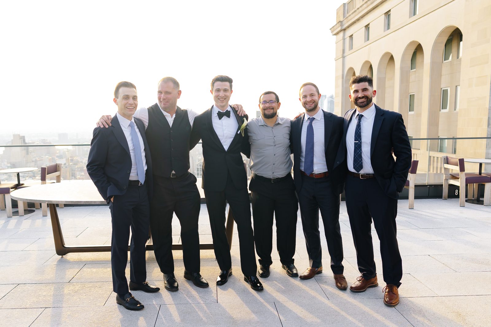 Family portraits at a Le Jardin sur Madison rooftop wedding