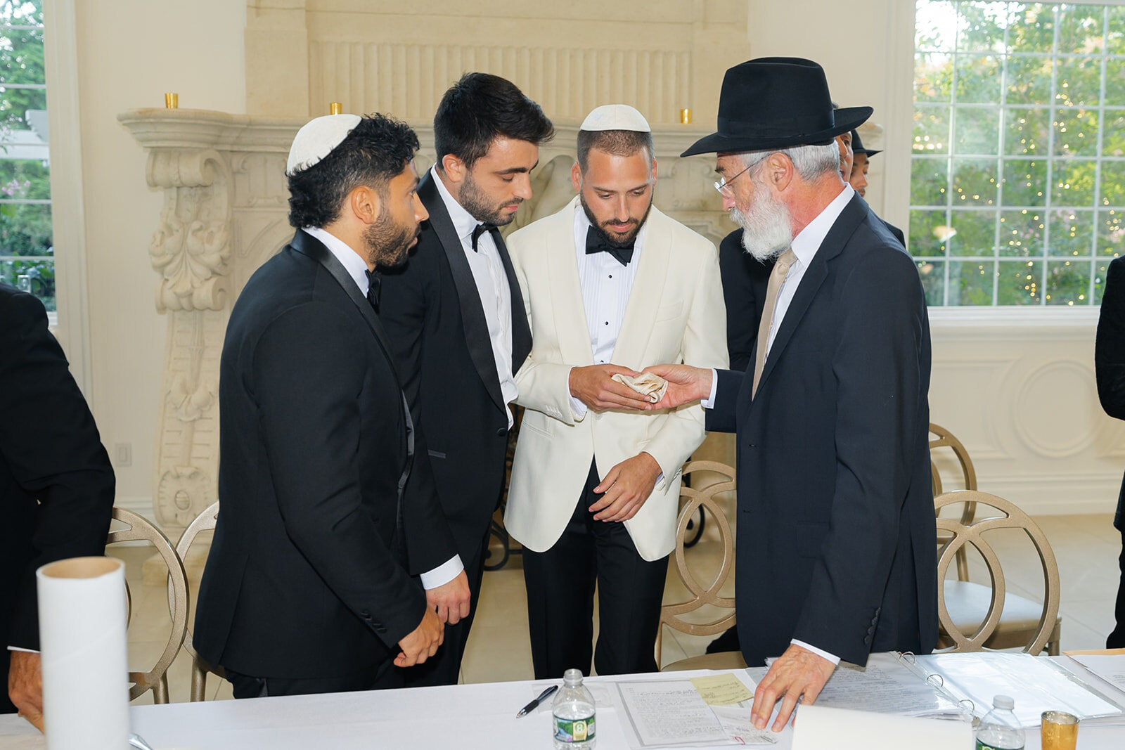 The ketubah signing, with Joel and the rabbis gathered around the table