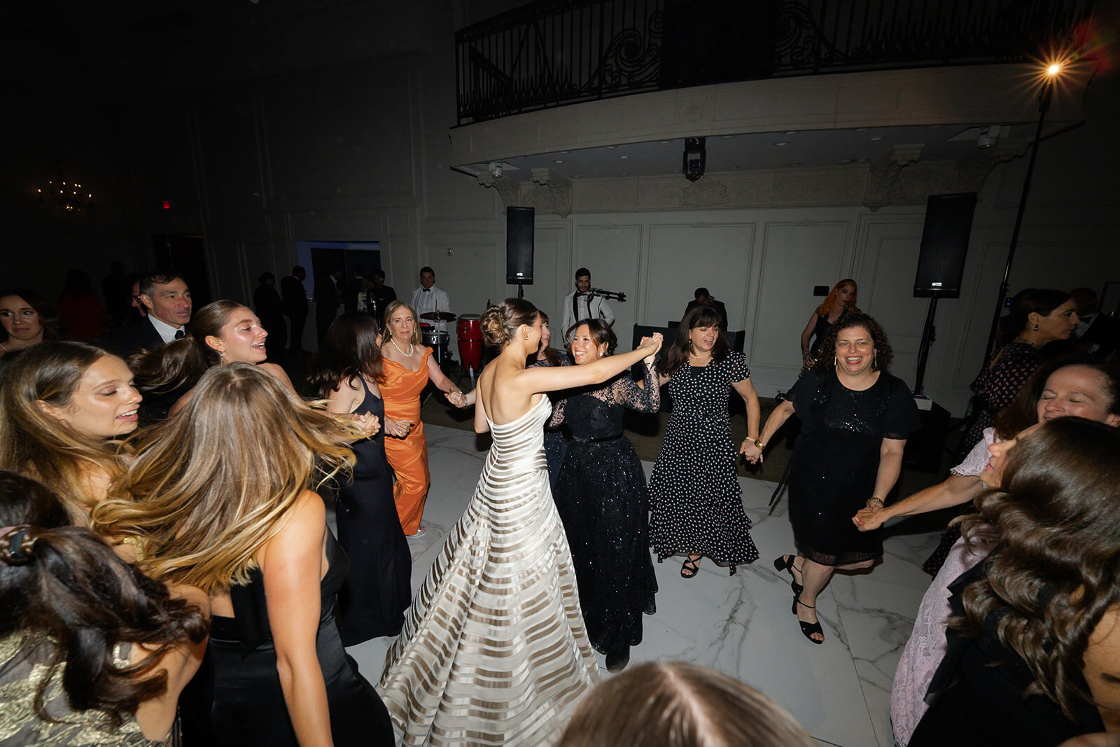Yarden spins in the center of the hora, guests dancing around her