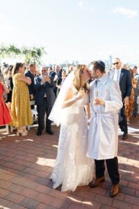 Champagne kiss after the ceremony, groom in traditional kittel, Brooklyn Jewish wedding