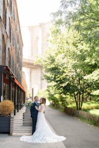 Summer wedding portrait in DUMBO with the Brooklyn Bridge overhead